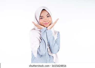 Headshot Of A Cute Muslim Teenager Wearing Hijab Showing Various Facial Expressions Isolated On White Background. Landscape Orientation.