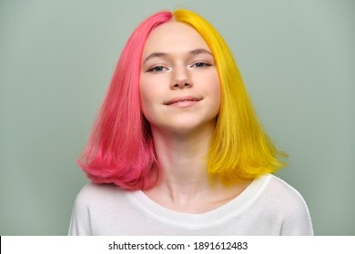 Headshot Of Fashionable Beautiful Teen Girl With Trendy Dyed Hair Against Green Background. Teenagers 16, 17 Years Old, Youth, Emotions, Lifestyle