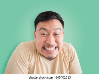 Headshot Of Funny Guilty Face Of Asian Man With Beard And Mustache.