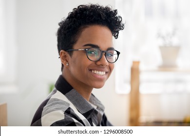 Headshot Of Happy African American Girl Looking At Camera, Black Woman Posing Indoors Smiling, Mixed Race Female Pretty Student, Millennial Businesswoman, Young Professional Wearing Glasses Portrait