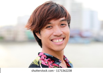 Headshot Of Happy Male Thai Teen In Hawaiian Shirt Is Smiling.