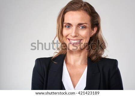 Headshot of middle age business woman in studio, isolated on grey