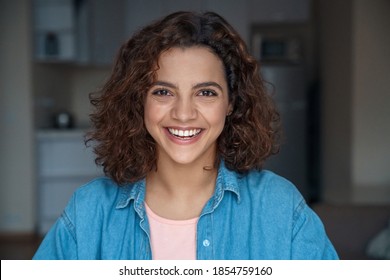 Headshot Portrait Of Beautiful Smiling Young Hispanic Woman Looking At Camera At Home. Happy Student Blogger Making Online Dating, Doing Job Interview During Video Chat Conference Call, Record Vlog.