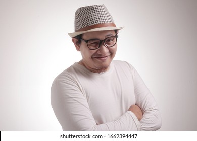 Headshot Portrait Of Funny Attractive Young Asian Man Smiling Flirty And Thinking Something Naughty, Close Up Headshot Portrait