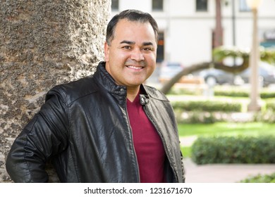 Headshot Portrait Of Handsom Hispanic Man.