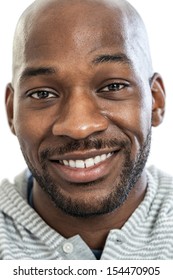 Headshot Portrait Of A Handsome Black Man Smiling In His Late 20s Isolated On White