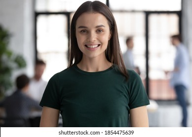 Headshot Portrait Profile Picture Of Happy Young Woman Employee Student Standing In Office College University At Workday Looking At Camera Satisfied Proud Of Being Staff Member Getting Good Education