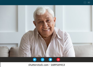 Headshot portrait screen view of smiling senior grandfather talk on video call on laptop with relatives or kids, happy elderly man speak have pleasant online Webcam conversation on computer at home