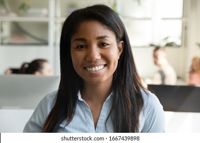 Headshot Portrait Of Smiling African American Female Employee Have Video Call Or Web Conference In Office, Profile Picture Of Happy Biracial Woman Worker Posing Look At Camera In Coworking Space