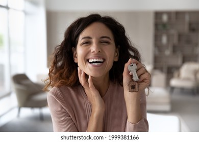 Headshot Portrait Of Smiling Hispanic Woman Look At Camera Show Keys To New Home Excited To Move In. Profile Picture Of Happy Latino Female Renter Buyer Overjoyed To Relocate. Renter, Rent Concept.