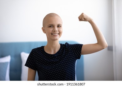 Headshot portrait of smiling young Caucasian hairless woman sick with cancer show power strength beat disease. Happy millennial female battle oncology, overjoyed about remission or recovery. - Shutterstock ID 1911361807