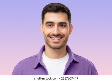 Headshot portrait smiling young man isolated purple background