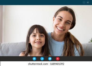 Headshot portrait of smiling young mother and little daughter speak talk on video call from home, screen view of happy mom and small girl child chat using Webcam, communicate online on quarantine