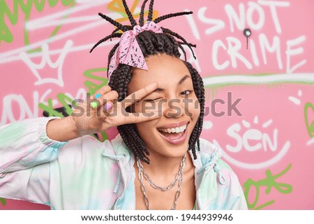 Similar – Image, Stock Photo Street of Peace is the name of the street sign on the wall. A part of a window is still visible.