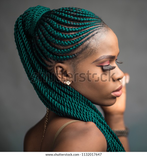 A headshot of a\
pretty young african lady