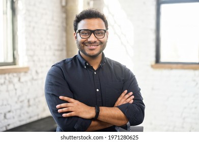 Headshot Of Skilled Hindu Male Employee Standing With Arms Crossed In Modern Office, Successful Confident Mixed-race Man Wearing Eyeglasses And Smart Casual, Business Portrait Of Indian Entrepreneur