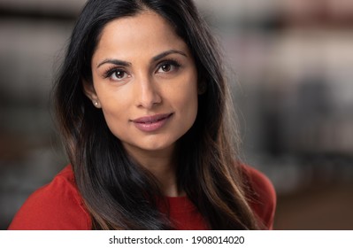 Headshots of beautiful Asian Indian woman in an office setting.