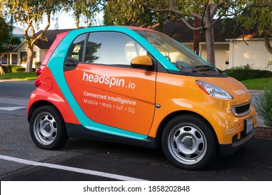 HeadSpin.io sign on mobile app testing vehicle parked at headquarters. HeadSpin is a company that develops a testing and mobile experience platform - Palo Alto, California, USA - 2020