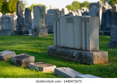 Headstones at a graveyard blank for copyspace - Shutterstock ID 1440472673