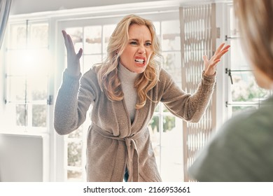 Heal Yourself So You Dont Project Onto Others. Shot Of A Mature Woman Looking Upset While Scolding Someone At Home.