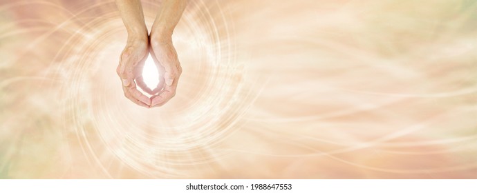 Healer Sending Unconditional Love Healing Energy -  Female Cupped Hands Making An O Shape With A Bright Light Between Against A Pale Golden Vortex Energy Field Flowing Across And Space For Messages
