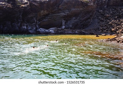 Healing baths in the hot springs of Palea Kameni off the coast of Santorini