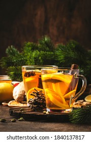 Healing Black Winter Tea With Ginger, Honey, Lemon. Immune Booster Drink In Glass Cup On Rustic Wooden Table Background With Copy Space