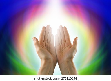 Healing Circle of Light - Female healer with hands open palm up surrounded by a rainbow circle of color and white light