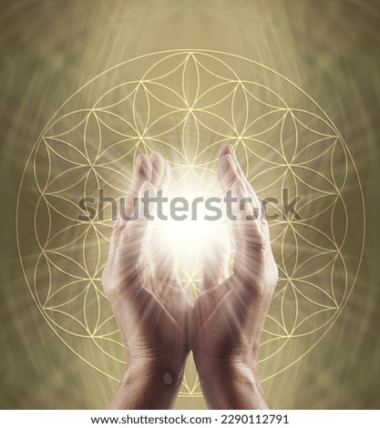 Healing Hands and Flower of Life Symbol Message Background - male parallel hands with white star light between against a golden Flower of Life background ideal for a spiritual holistic healing theme

