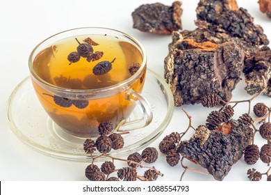 Healing tea from cones of alder and birch mushroom chaga is used in folk medicine