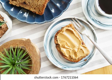 Health benefits of peanut butter Fresh baked homemade banana bread slice with creamy peanut butter spread on top. Weight-loss diet, Bodybuilding, Protein, Allergy,   Sugar levels, Magnesium, Vitamin E