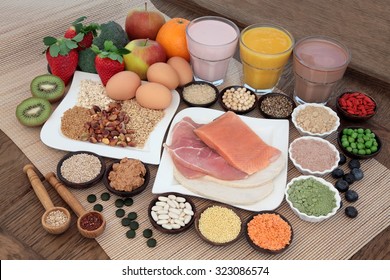 Health And Body Building Food With Fish And Meat, Supplement Powders, Vitamin Tablets, Pulses, Nuts, Vegetables, Fruit And High Protein And Juice Smoothie Shakes.