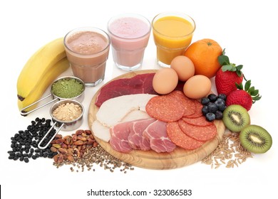 Health And Body Building High Protein Food With Supplement Powders, Smoothies, Dairy, Fruit, Grains, Seeds, Pulses And Nuts Over White Background.