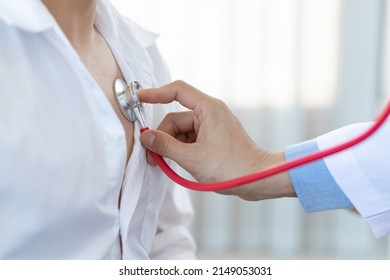 Health care concept medical and diagnosis. Close up doctor using stethoscope physical examination of the patient listening to the respiratory system and lungs. - Shutterstock ID 2149053031