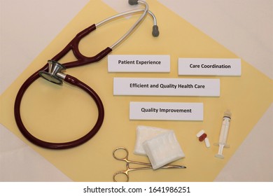 Health Care Concepts Displayed With Medical Supplies On Yellow Background; Patient Experience, Care Coordination, Efficient And Quality Health Care, Quality Improvement