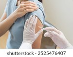 Health care, corona virus, hand of woman nurse, doctor giving syringe vaccine, injection dose on arm sick patient at clinic. Vaccination, immunization disease prevention against flu pandemic influenza