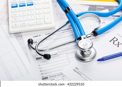 Health care costs. Stethoscope and calculator 