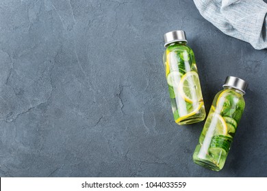 Health Care, Fitness, Healthy Nutrition Diet Concept. Fresh Cool Lemon Cucumber Mint Infused Water, Cocktail, Detox Drink, Lemonade In A Glass Jar For Spring Summer Days. Top View Flat Lay Background