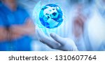 Health care and medical services concept with world or global form and AR interface.Medical Doctor holding a world globe in her hands as medical network concept 