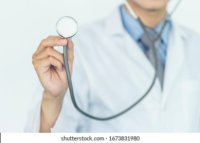 Health care and medical services concept. Close up of Medical doctor with a stethoscope in the hands.