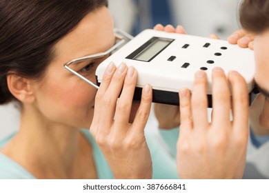 health care, medicine, people, eyesight and technology concept - close up of optometrist with pupillometer checking patient intraocular pressure at eye clinic or optics store - Powered by Shutterstock