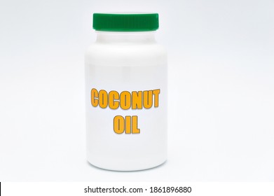 Health Care - Nutritional Supplement - Bottle Of Coconut Oil. Isolated On A White Background. Copy Space.