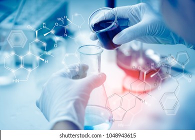 Health Care Researchers Working In Life Science Laboratory. Young Female Research Scientist Analyzing Microscope Slides In Research Lab.