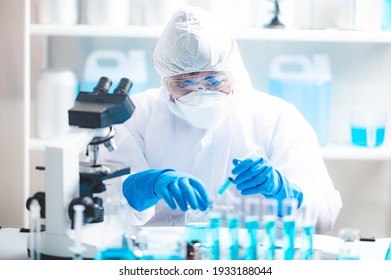 Health care researchers working in life science laboratory, medical science technology research work for test a vaccine, coronavirus covid-19 vaccine protection cure treatment - Powered by Shutterstock