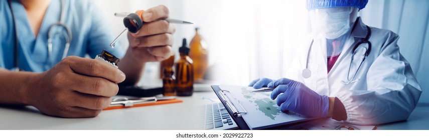 Health Care Researchers Working In Life Science Laboratory And Analyzing Microscope Slides In Research Lab. New Epidemic Corona Virus. Corona Virus Outbreaking.