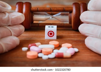 Health Care And Risk Of Death From Accidental Overdose Concept. Pills And Dice On Wooden Background 
