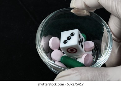 Health Care And Risk Of Death From Accidental Overdose Concept,soft Focus Dice And Pill And Capsule In Mini Cup 