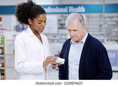 Health Care Thats Simplified And Direct To Your Needs. Shot Of A Young Pharmacist Recommending A Health Care Product To A Senior Citizen At A Pharmacy.