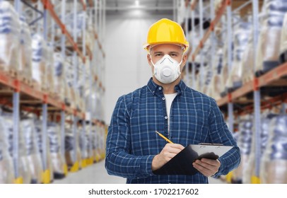 Health Care, Work And Pandemic Concept - Male Worker In Safety Helmet Wearing Face Protective Mask Or Respirator With Clipboard And Pencil Over Warehouse Background