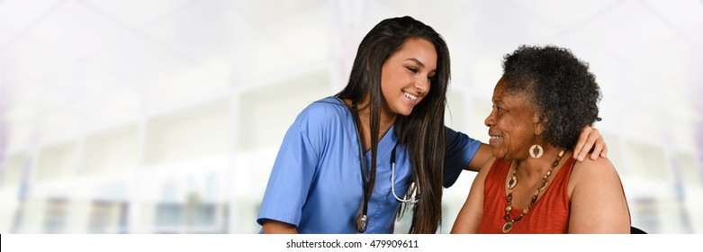 Health care worker helping an elderly woman 
